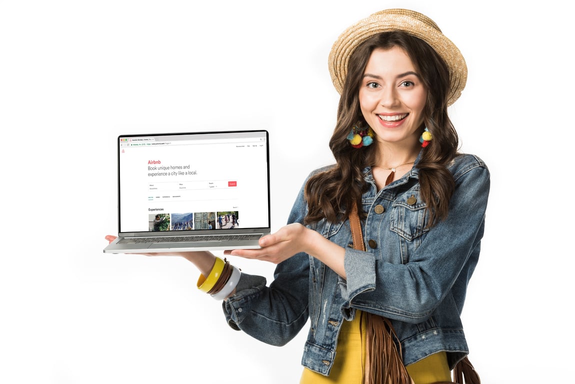 Woman showing Airbnb website